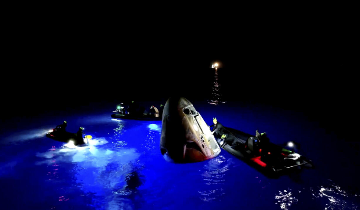 This image made from SpaceX video shows its capsule, center, carrying tech entrepreneur Jared Isaacman with his crew after it reached the Gulf of Mexico near Florida&#039;s Dry Tortugas early Sunday, Sept. 15, 2024.