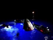 This image made from SpaceX video shows its capsule, center, carrying tech entrepreneur Jared Isaacman with his crew after it reached the Gulf of Mexico near Florida&#039;s Dry Tortugas early Sunday, Sept. 15, 2024.