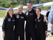 Astronauts, from left, mission specialist Anna Menon, pilot Scott Poteet, commander Jared Isaacman and mission specialist Sarah Gillis arrive at the Kennedy Space Center for an upcoming private human spaceflight mission in Cape Canaveral, Fla., Monday, Aug. 19, 2024.