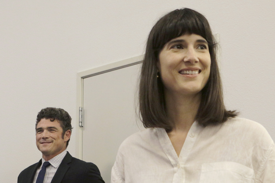 Republican Joe Kent, left, and Democrat Marie Gluesenkamp Perez wait before taking the stage for a debate in the race for the 3rd Congressional District in 2022. Five debates are slated for October as the candidates head for a rematch in November.