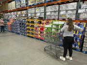 Shoppers consider purchases in a Costco warehouse Thursday, Sept. 12, 2024, in Thornton, Colo.