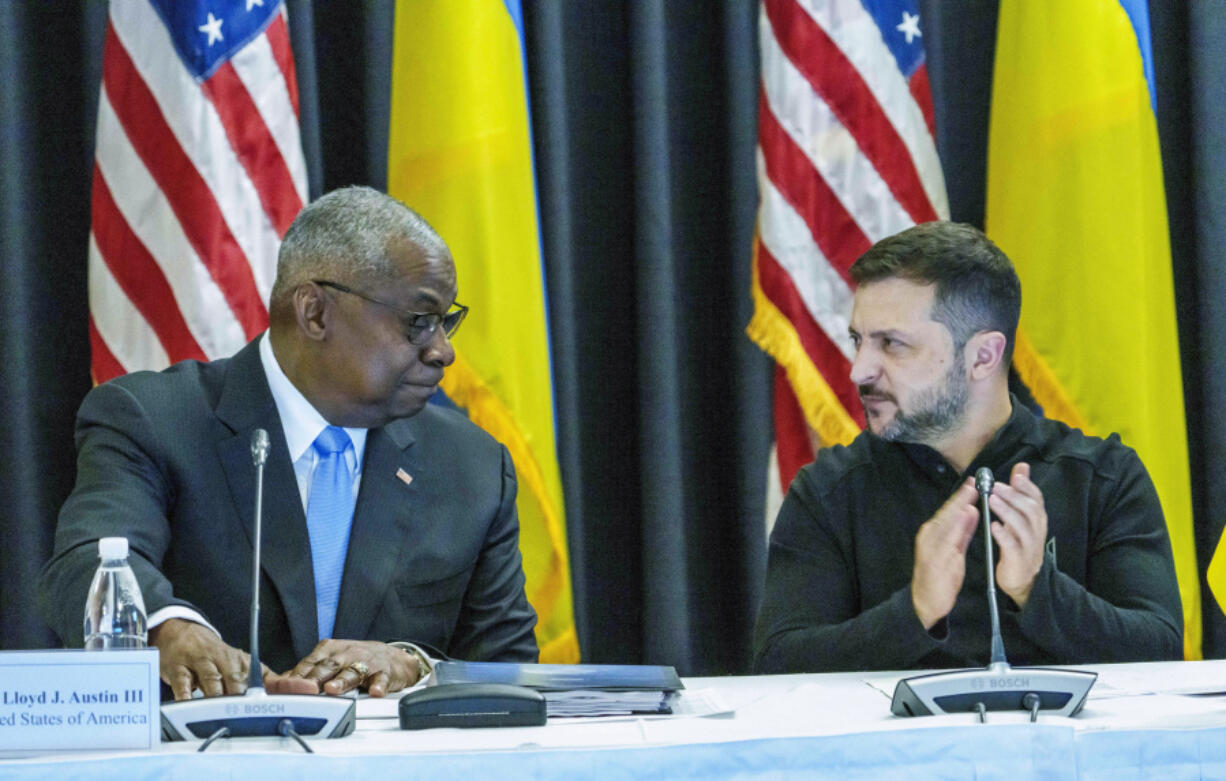 Defense Secretary Lloyd Austin, left and Ukrainian President Volodymyr Zelenskyy look at each other during the Ukraine Contact Group meeting at Ramstein Air Base, Friday, Sept.6, 2024.