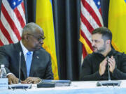 Defense Secretary Lloyd Austin, left and Ukrainian President Volodymyr Zelenskyy look at each other during the Ukraine Contact Group meeting at Ramstein Air Base, Friday, Sept.6, 2024.