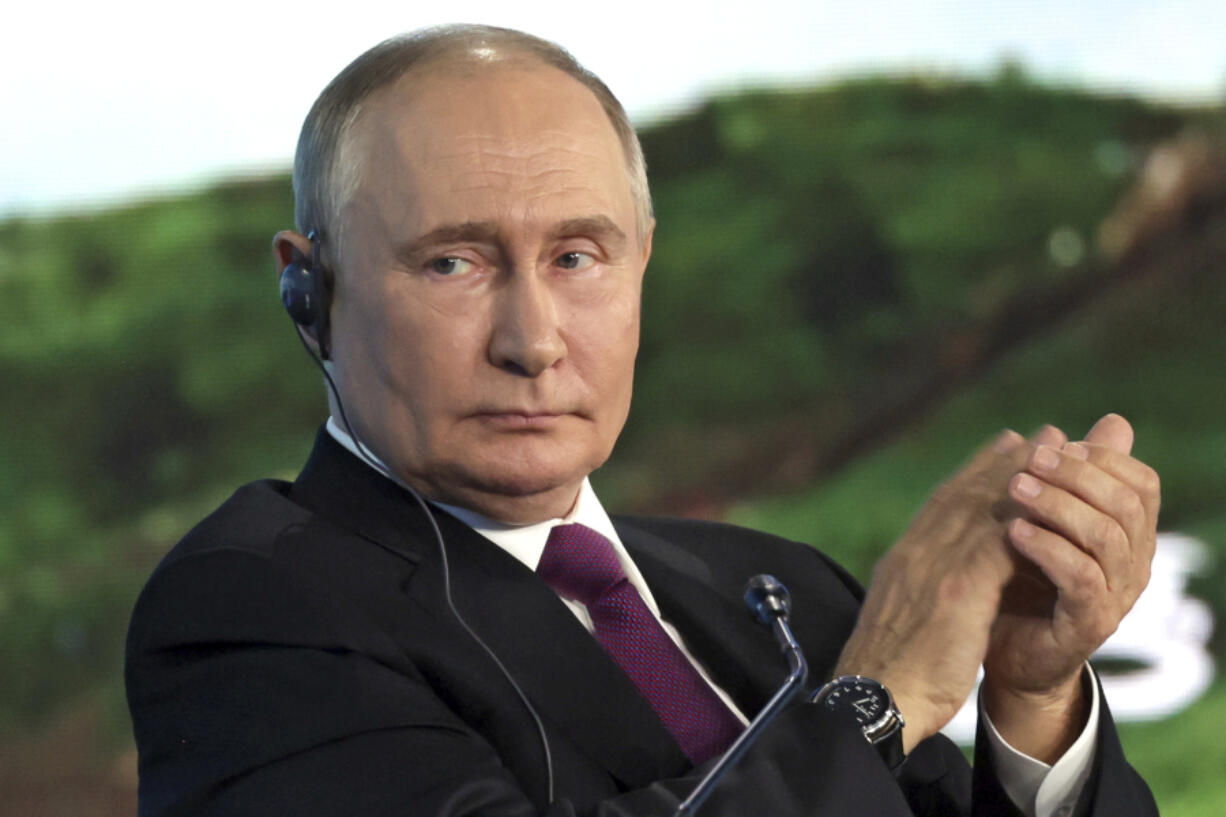 Russian President Vladimir Putin applauds during the plenary session of the Eastern Economic Forum in Vladivostok, Russia, Thursday, Sept. 5, 2024.