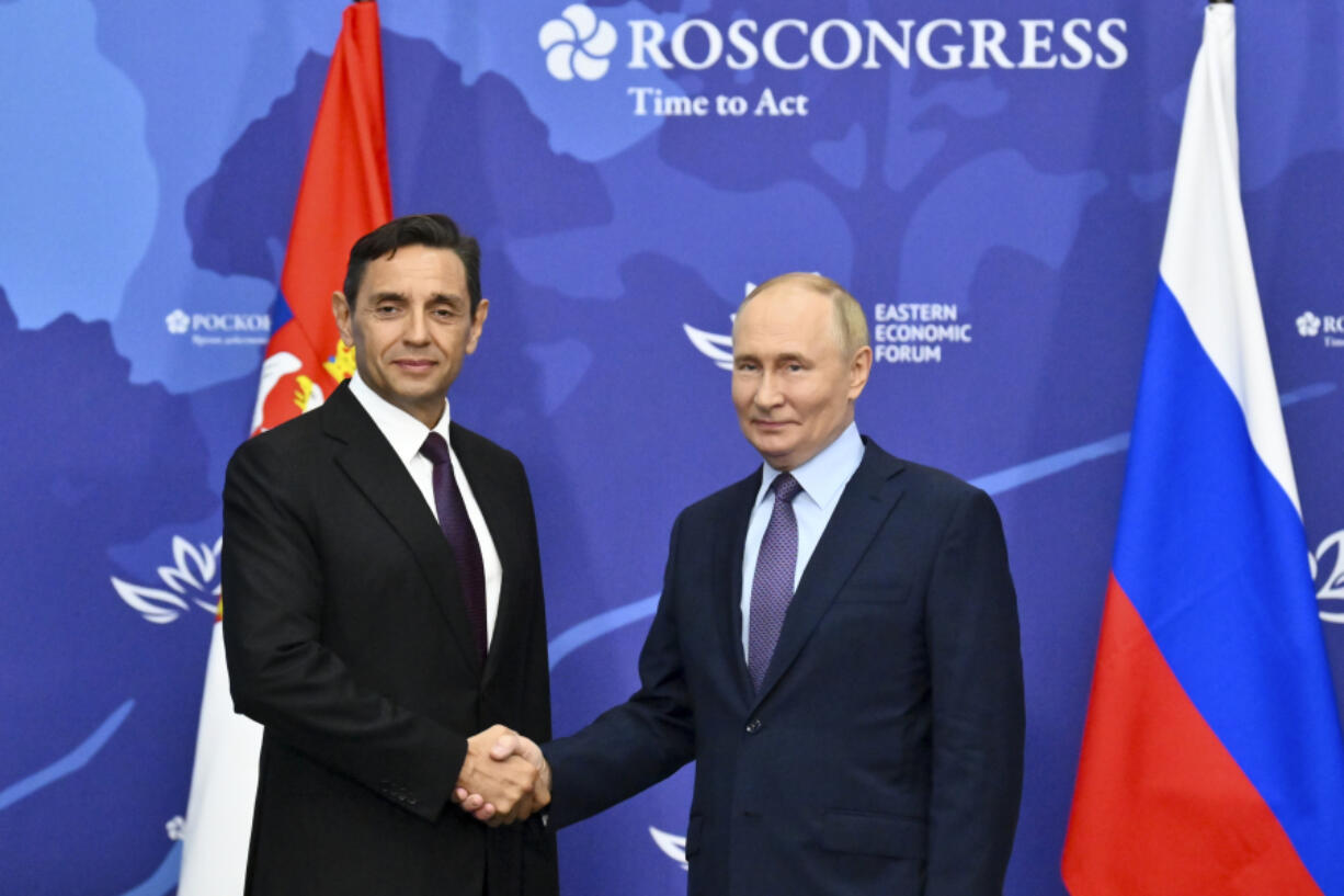 Russian President Vladimir Putin, right, and Serbian Deputy Prime Minister Aleksandar Vulin pose for a photo on the sidelines of the Eastern Economic Forum in Vladivostok, Russia, Wednesday, Sept. 4, 2024.