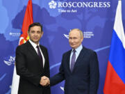 Russian President Vladimir Putin, right, and Serbian Deputy Prime Minister Aleksandar Vulin pose for a photo on the sidelines of the Eastern Economic Forum in Vladivostok, Russia, Wednesday, Sept. 4, 2024.