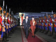 Russian President Vladimir Putin, on red carpet left, walks next to Mongolian Foreign Minister of Mongolia, Batmunkh Battsetseg upon his arrival at Ulaanbaatar&#039;s International airport Chinggis Khaan, late Monday, Sept. 2, 2024.