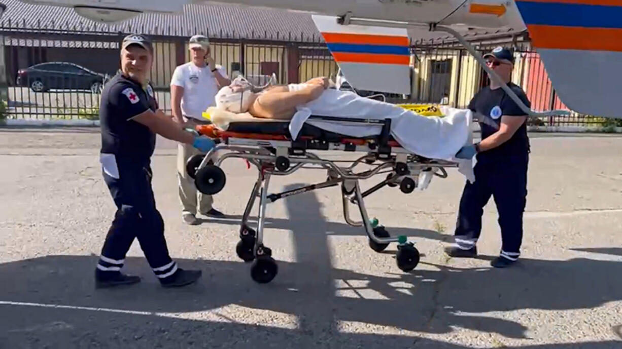 In this photo taken from video released by Moscow Region Governor Andrei Vorobyev official telegram channel, medical workers roll on a stretcher with a wounded man to a helicopter and transfer him to a Moscow&#039;s hospital, after an alleged Ukrainian drone attack on multi-storey residential building in Ramenskoye, outside Moscow, Moscow region, Russia, on Tuesday, Sept. 10, 2024.