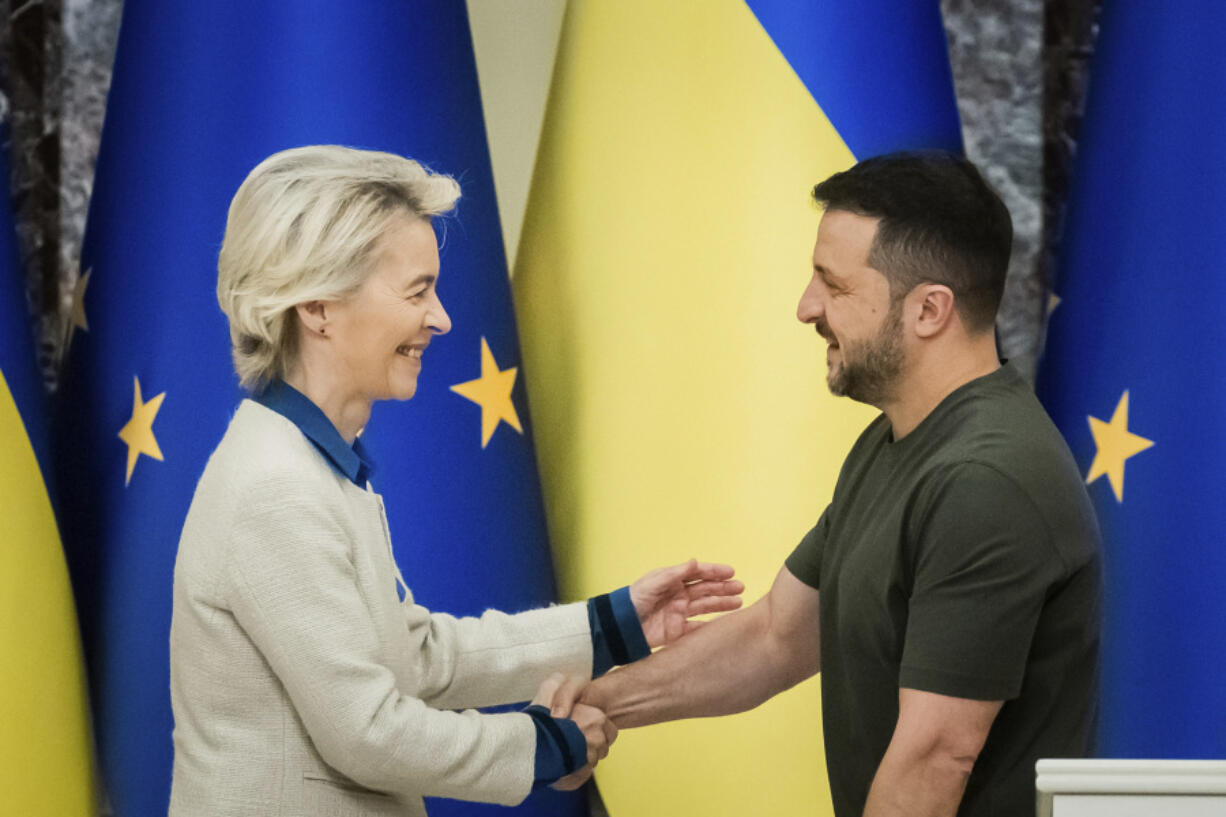 Ursula von der Leyen, left, President of the European Commission, shakes hands with Ukrainian President Volodymyr Zelenskyy, following a joint press conference in Kyiv, Ukraine, Friday, Sept. 20, 2024.