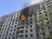 Flames rise after a Russian aerial bomb struck a multi-story residential building in Kharkiv, Ukraine, Sunday Sept. 15, 2024.