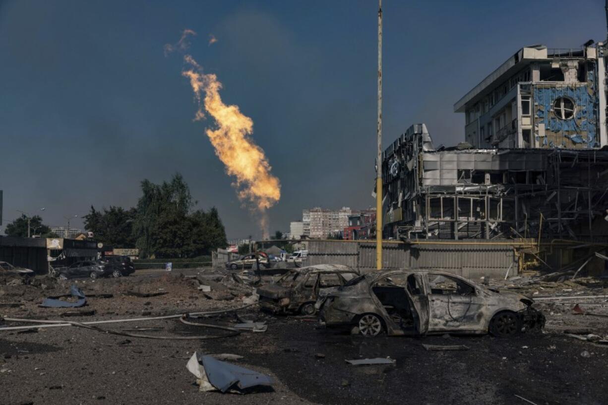 Gas burns in front of a business center damaged by a Russian attack in Kharkiv, Ukraine, Sunday, Sept. 1 2024.