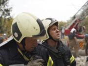 In this photo provided by the State Emergency Service of Ukraine on September 4, 2024, Rescuers work at a site of military university hit by a Russian strike in Poltava, Ukraine.