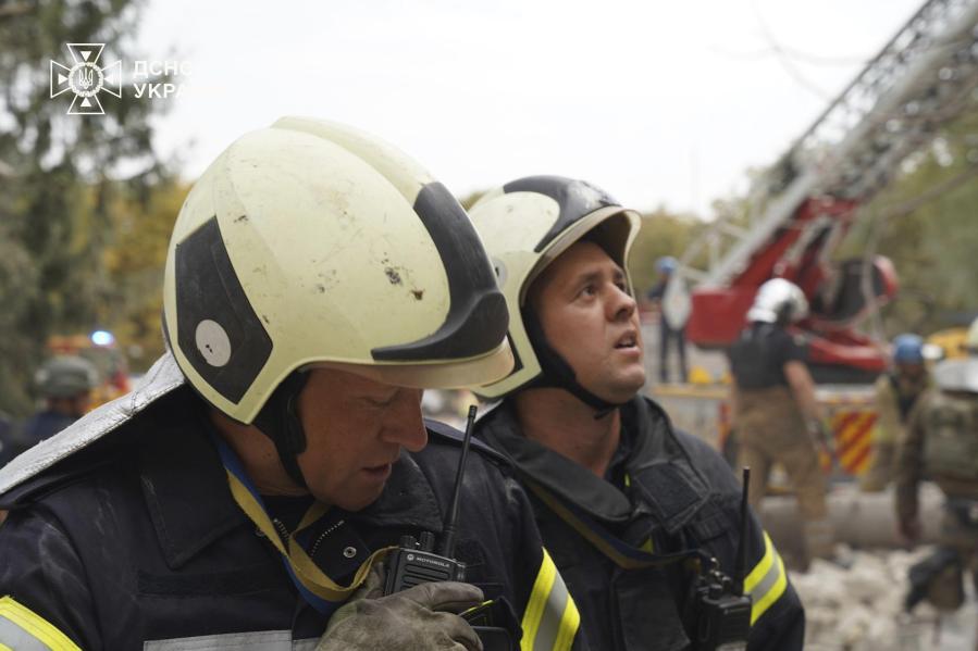 In this photo provided by the State Emergency Service of Ukraine on September 4, 2024, Rescuers work at a site of military university hit by a Russian strike in Poltava, Ukraine.