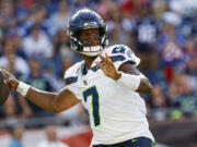 Seattle Seahawks quarterback Geno Smith (7) prepares to make a pass during overtime of an NFL football game against the New England Patriots on Sunday, Sept. 15, 2024, in Foxborough, Mass. The Seattle Seahawks defeated the New England Patriots 23-20. (AP Photo/Greg M.