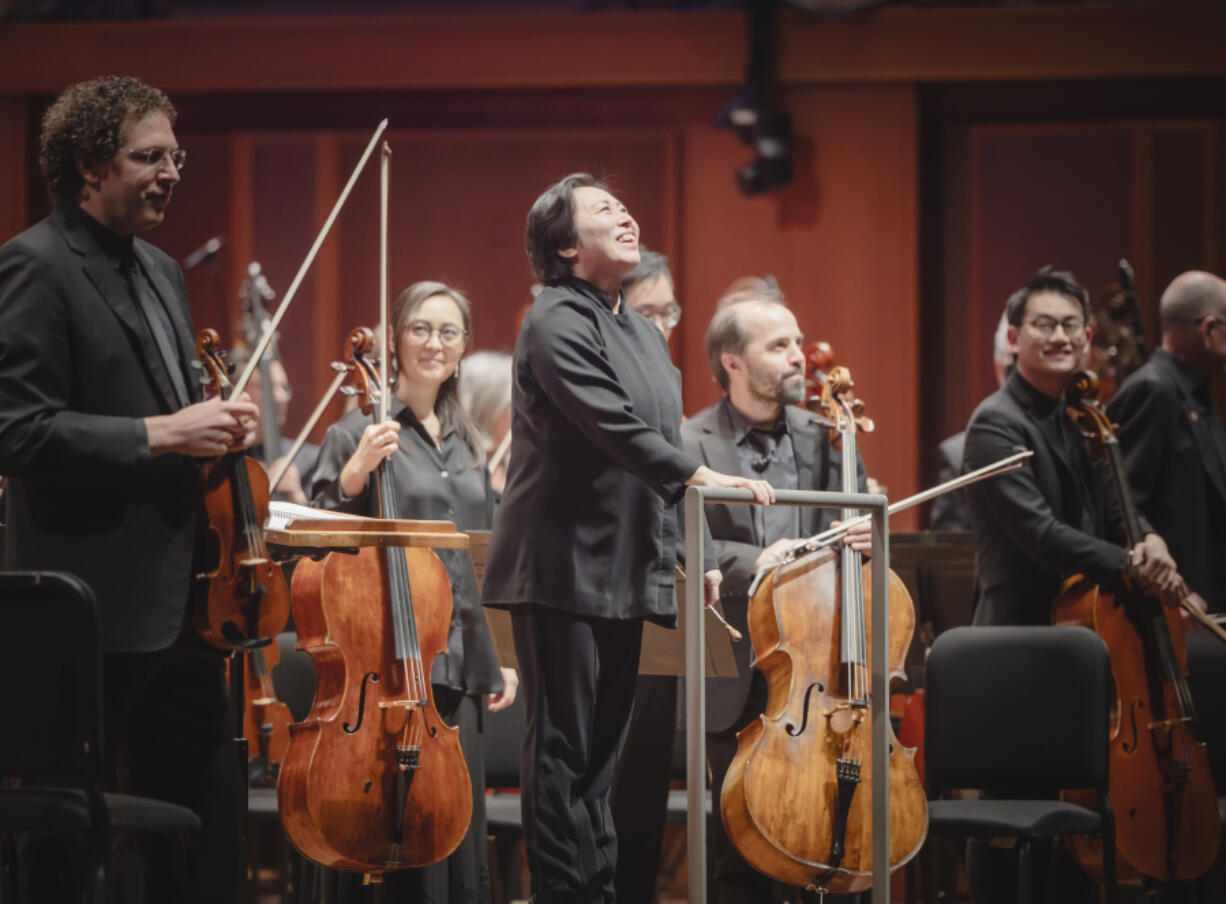 Xian Zhang, center, on April 4 during a pre-concert performance at Benaroya Hall in Seattle.