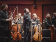 Xian Zhang, center, on April 4 during a pre-concert performance at Benaroya Hall in Seattle.