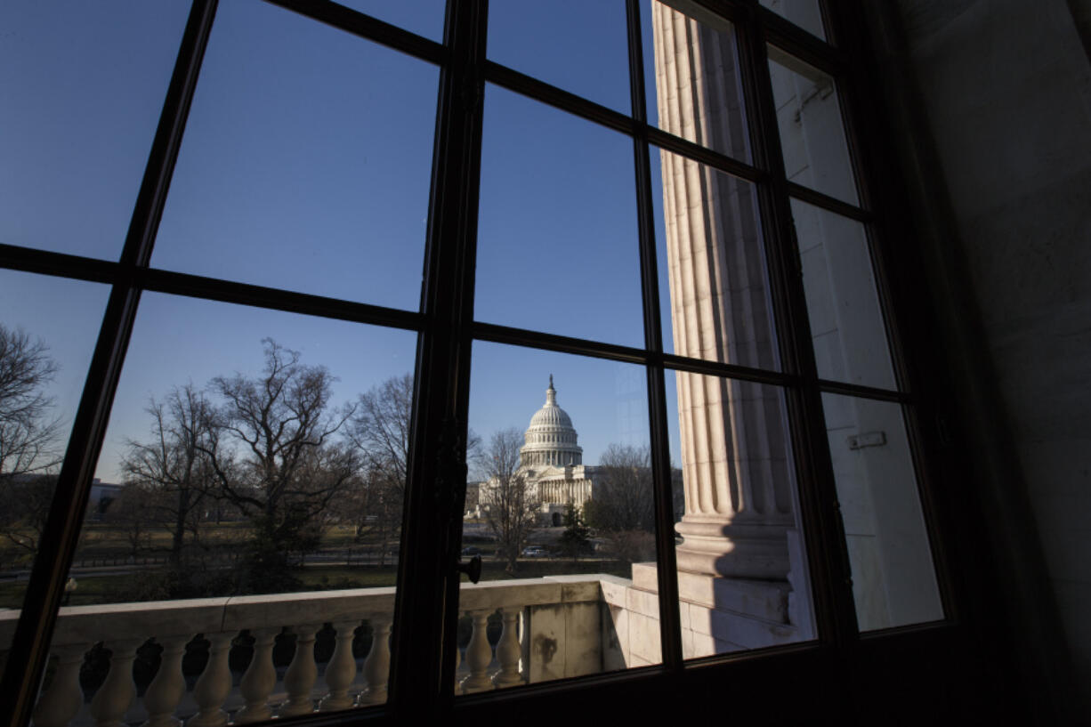 The Capitol is seen from the Russell Senate Office Building as Congress returns from a district work week, in Washington, March 24, 2014.  (AP Photo/J.