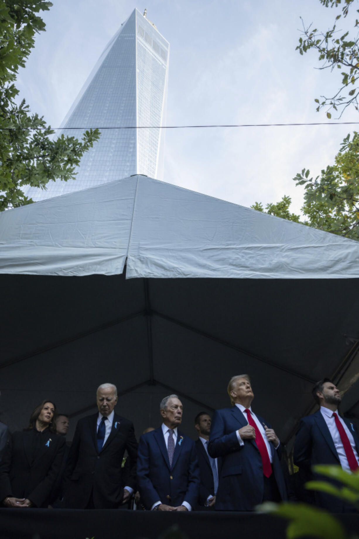 From left, Democratic presidential nominee Vice President Kamala Harris, President Joe Biden, Michael Bloomberg, Republican presidential nominee former President Donald Trump and Republican vice presidential nominee Sen. JD Vance, R-Ohio, attend the 9/11 Memorial ceremony on the 23rd anniversary of the Sept. 11, 2001 attacks, Wednesday, Sept. 11, 2024, in New York.