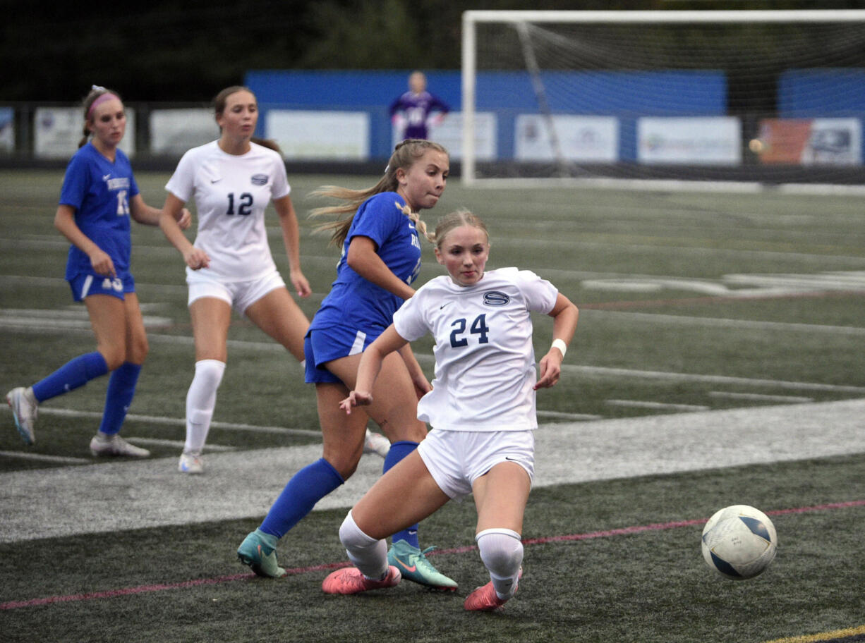 Skyview's Lauryn Cornelius (24) draws a foul against Ridgefield's Ellie Wilson (4) during a non-leauge girls soccer game on Tuesday, Sept. 10, 2024, at Ridgefield High School.