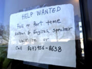 A hiring sign is displayed at a restaurant in Mount Prospect, Ill., Feb. 1, 2024. (AP Photo/Nam Y.