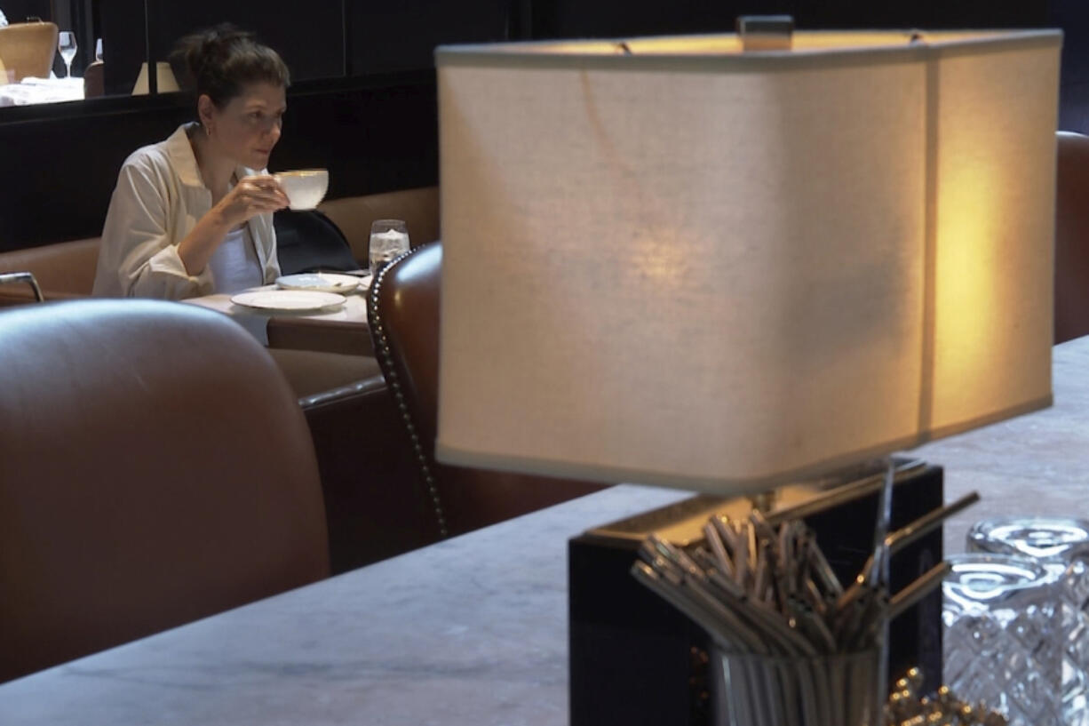 Parisa Imanirad, a scientist and cancer researcher, eats lunch alone at Spruce, an upscale restaurant in San Francisco, on Thursday, Aug. 22, 2024.