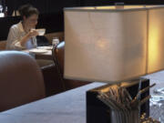 Parisa Imanirad, a scientist and cancer researcher, eats lunch alone at Spruce, an upscale restaurant in San Francisco, on Thursday, Aug. 22, 2024.