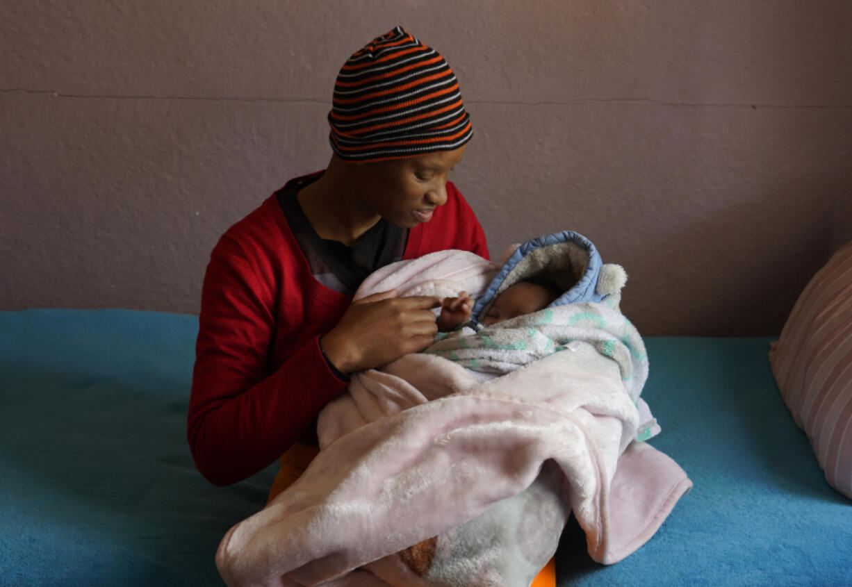 Mapule Radebe holds her baby Minehle at Nkosi&rsquo;s Haven, a home that assists women with HIV, on Aug. 5 in Johannesburg, South Africa.