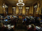 Georgia&#039;s State Election Board members discuss proposals to a full room for election rule changes at the state capitol, Friday, Sept. 20, 2024, in Atlanta.