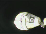 In this image from video provided by NASA, the unmanned Boeing Starliner capsule undocks as it pulls away from the International Space Station on Friday, Sept. 6, 2024.