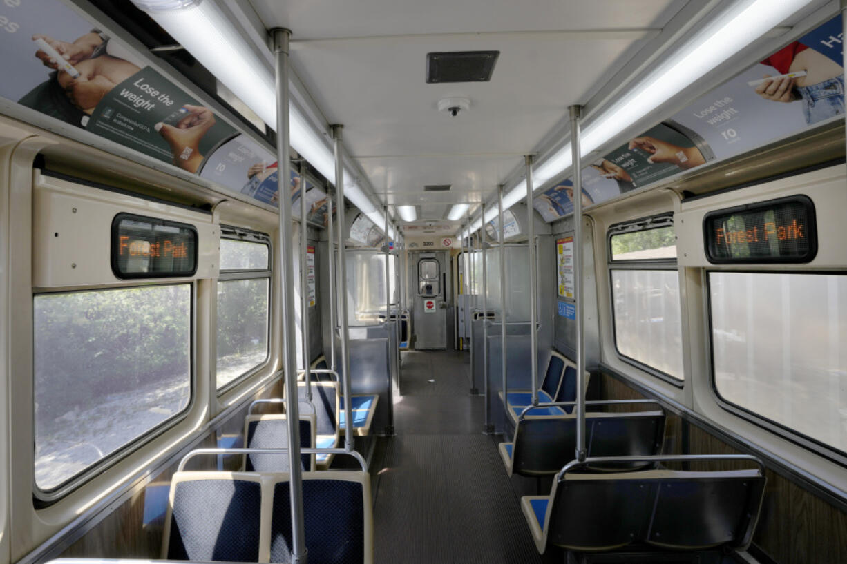 A Chicago Transit Authority Blue Line train car rides empty as it approaches the Forest Park, Ill., station Tuesday, Sept. 3, 2024, in Forest Park.