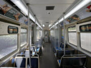 A Chicago Transit Authority Blue Line train car rides empty as it approaches the Forest Park, Ill., station Tuesday, Sept. 3, 2024, in Forest Park.