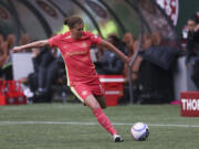 FILE - Portland Thorns FC midfielder Christine Sinclair (12) controls the ball during an NWSL soccer match against NJ/NY Gotham FC in Portland, Ore., March 24, 2024.