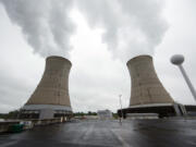 FILE - This May 22, 2017 file photo, shows cooling towers at the Three Mile Island nuclear power plant in Middletown, Pa.