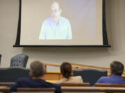 Steven Ross, former OceanGate scientific director, top, speaks via video link as he testifies during the Titan marine board formal hearing inside the Charleston County Council Chambers, Thursday, Sept. 19, 2024, in North Charleston, S.C.