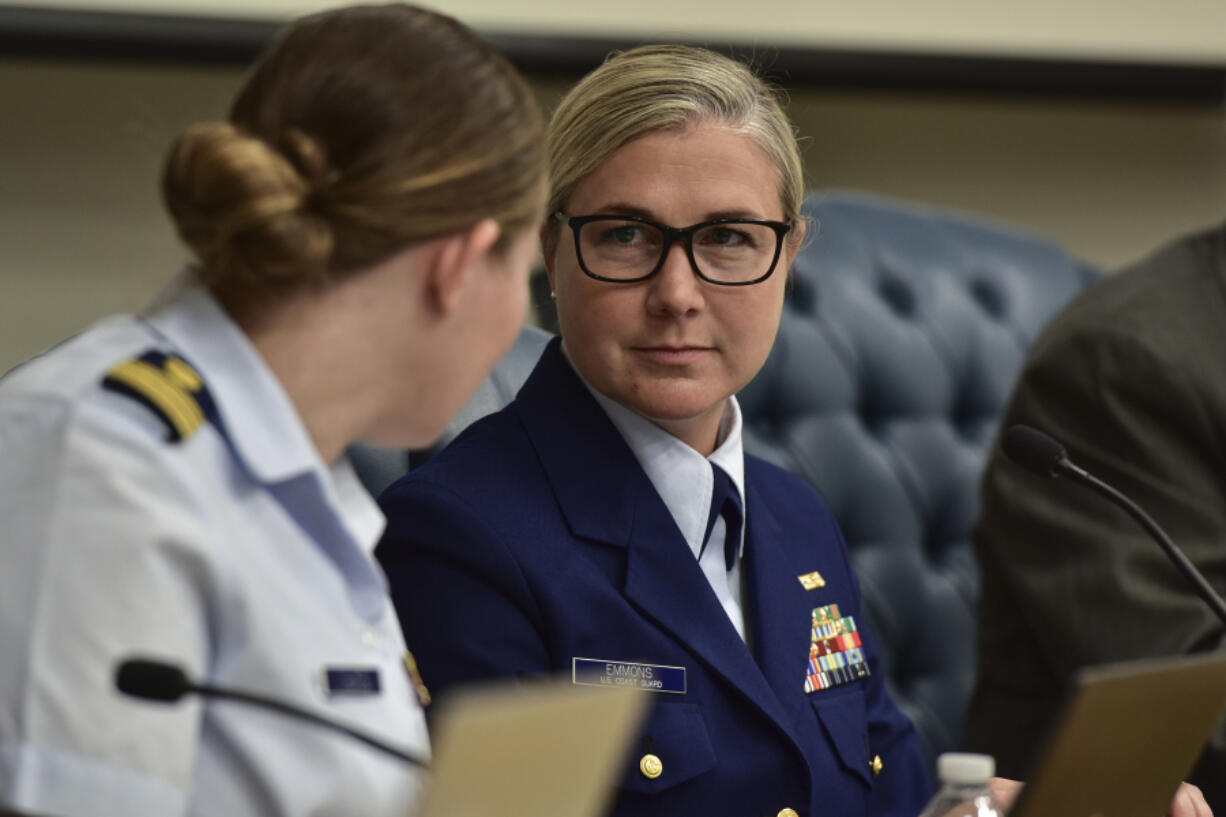 Lt. Cmdr. Nicole Emmons, U.S. Coast Guard Marine Board of Investigation technical advisor, center right, speaks with board members, Wednesday, Sept. 25, 2024, at the U.S. Coast Guard Marine Board of Investigation hearing into the June 2023 loss of the Titan submersible, in North Charleston, S.C. (Petty Officer 2nd Class Kate Kilroy/U.S.