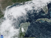 This Sunday, Sept. 8, 2024 satellite image provided by the National Oceanic and Atmospheric Administration shows a tropical disturbance in the Gulf of Mexico expected to bring significant rainfall to parts of Texas and Louisiana this week, possibly developing into a stronger storm, including a hurricane, according to the National Weather Service.