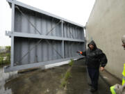 Workers from the Southeast Louisiana Flood Protection Authority-West close floodgates along the Harvey Canal, just outside the New Orleans city limits, in anticipation of Tropical Storm Francine, in Harvey, La., Tuesday, Sept. 10, 2024.