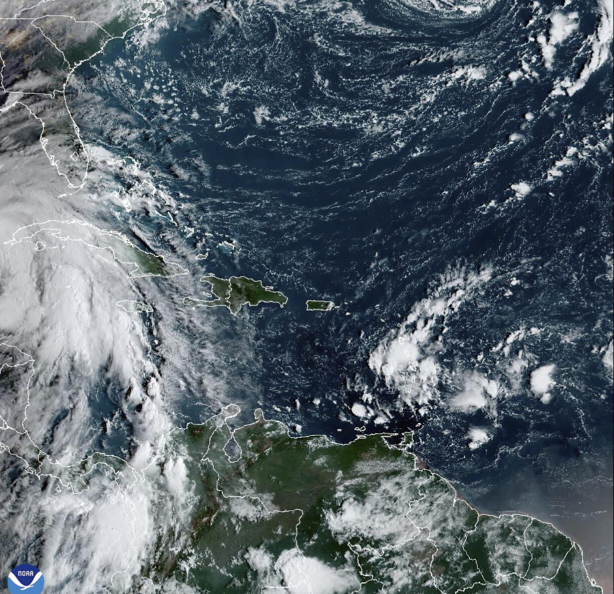 This satellite image provided by NOAA shows Tropical Storm Helene in the Caribbean Sea on Wednesday, Sept. 25, 2024.