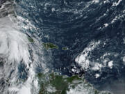 This satellite image provided by NOAA shows Tropical Storm Helene in the Caribbean Sea on Wednesday, Sept. 25, 2024.