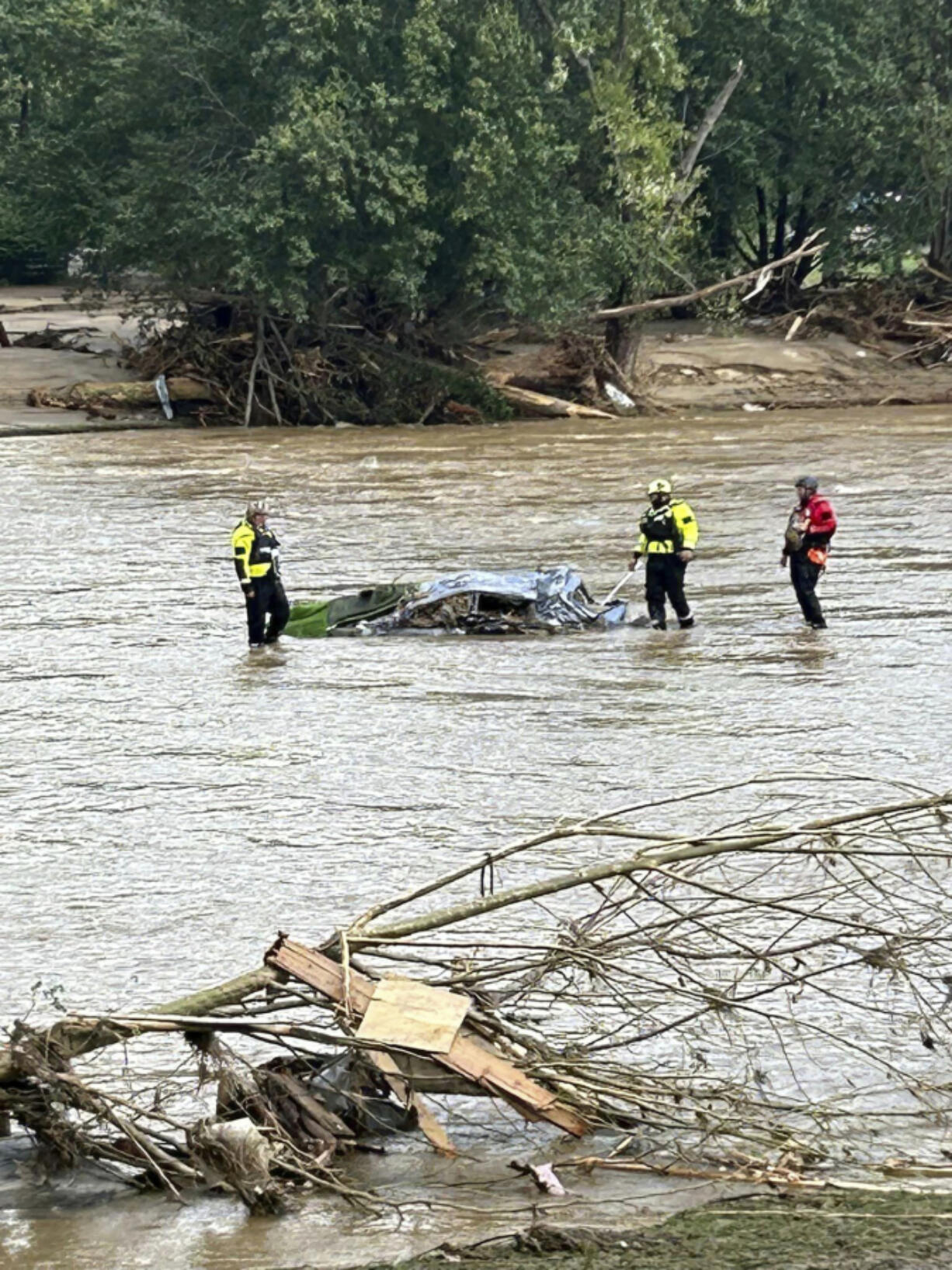 Rescue workers from the Pamlico County rescue team are shown working in the aftermath of Helene the area of Chimney Rock, N.C., Saturday, Sept. 28, 2024.