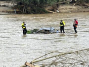 Rescue workers from the Pamlico County rescue team are shown working in the aftermath of Helene the area of Chimney Rock, N.C., Saturday, Sept. 28, 2024.