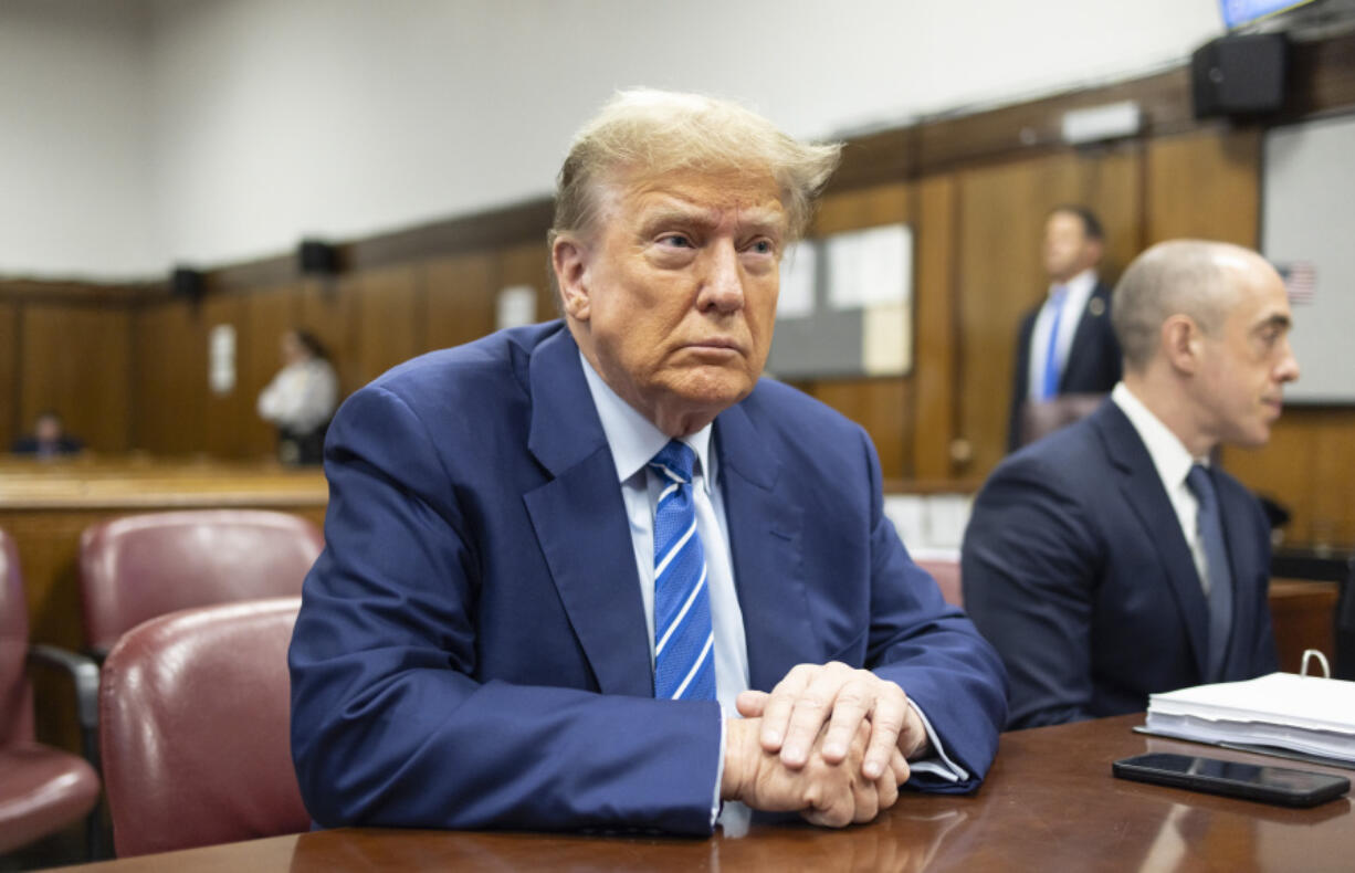 FILE - Former President Donald Trump awaits the start of proceedings on the second day of jury selection at Manhattan criminal court, April 16, 2024, in New York.  Manhattan prosecutors are balking at Donald Trump efforts to delay post-trial decisions in his New York hush money criminal case as he seeks to have a federal court intervene and potentially overturn his felony conviction. They lodged their objections in a letter Tuesday to the trial judge but said they could be OK with postponing the ex-president&rsquo;s Sept. 18 sentencing.