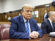 FILE - Former President Donald Trump awaits the start of proceedings on the second day of jury selection at Manhattan criminal court, April 16, 2024, in New York.  Manhattan prosecutors are balking at Donald Trump efforts to delay post-trial decisions in his New York hush money criminal case as he seeks to have a federal court intervene and potentially overturn his felony conviction. They lodged their objections in a letter Tuesday to the trial judge but said they could be OK with postponing the ex-president&rsquo;s Sept. 18 sentencing.