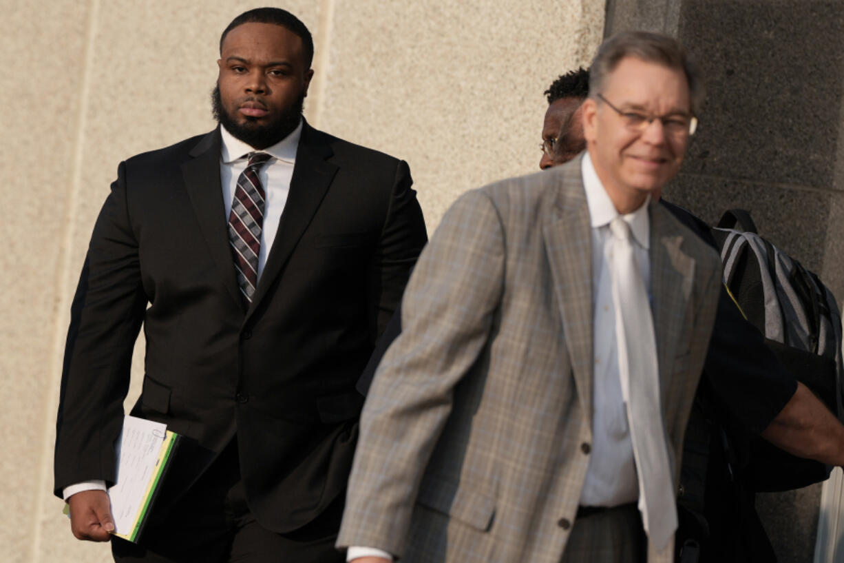 Former Memphis police officer Demetrius Haley, left, leaves the federal courthouse after the first day of jury selection of the trial in the Tyre Nichols case Monday, Sept. 9, 2024, in Memphis, Tenn.