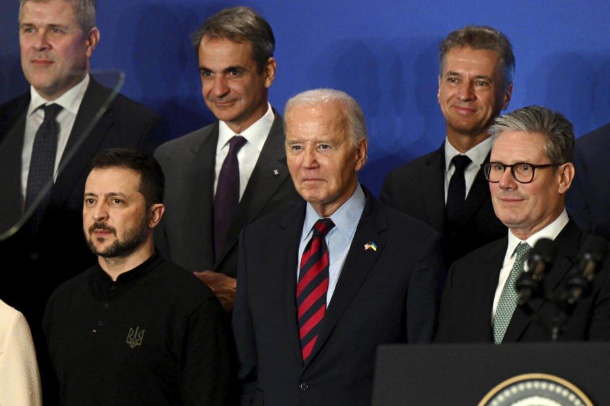 U.S. President Joe Biden, center, with Ukraine&rsquo;s President Volodymyr Zelenskyy, left, Britain&rsquo;s Prime Minister Keir Starmer, right, and other world leaders pose for a family picture of the launching of a Joint Declaration of Support for Ukrainian Recovery and Reconstruction, Wednesday, Sept. 25, 2024, in New York.