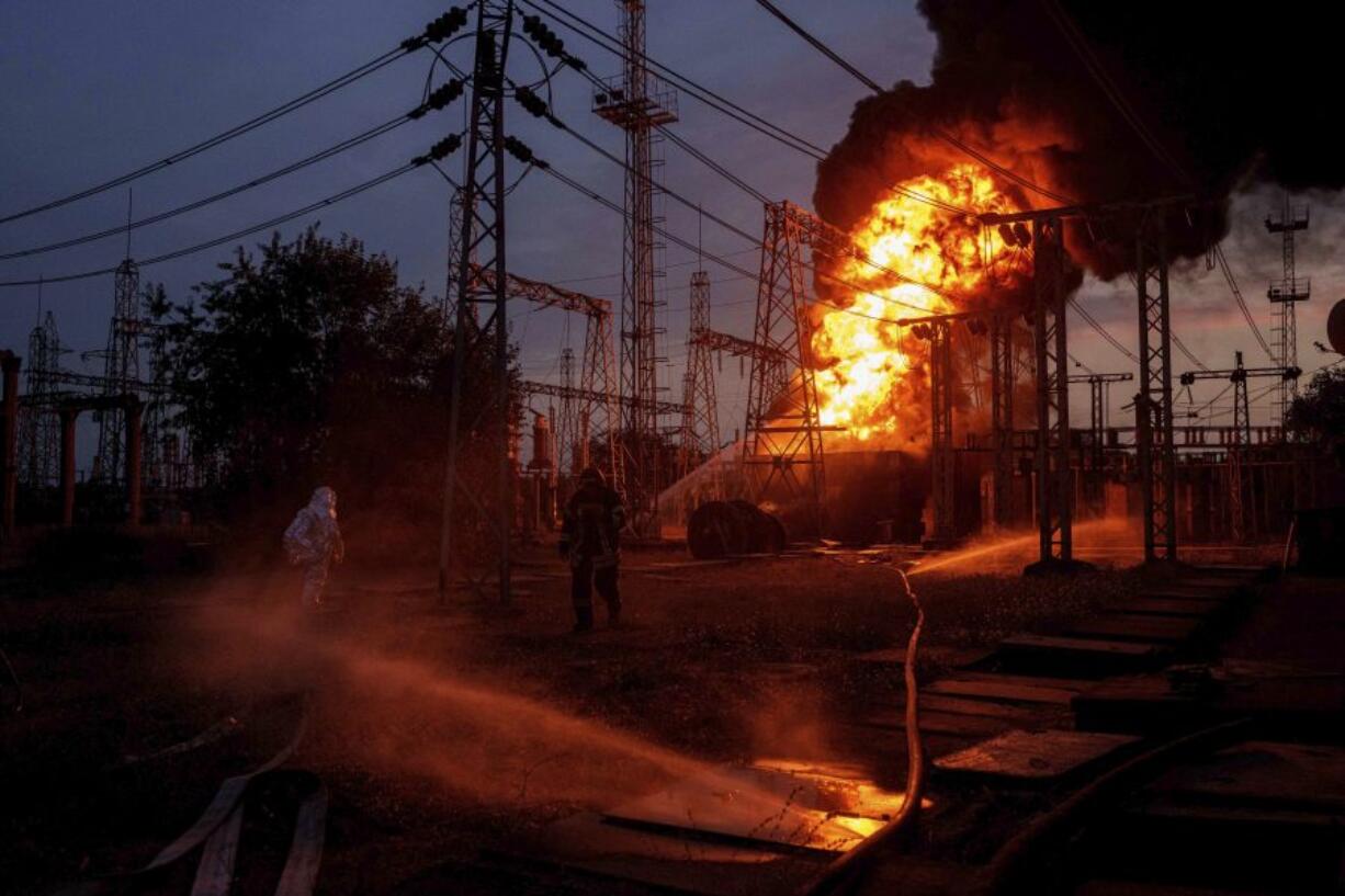 Rescue workers extinguish a fire of burning electrical substation hit by a Russian bombing in Dnipropetrovsk region, Ukraine, Monday, Sept. 2, 2024.