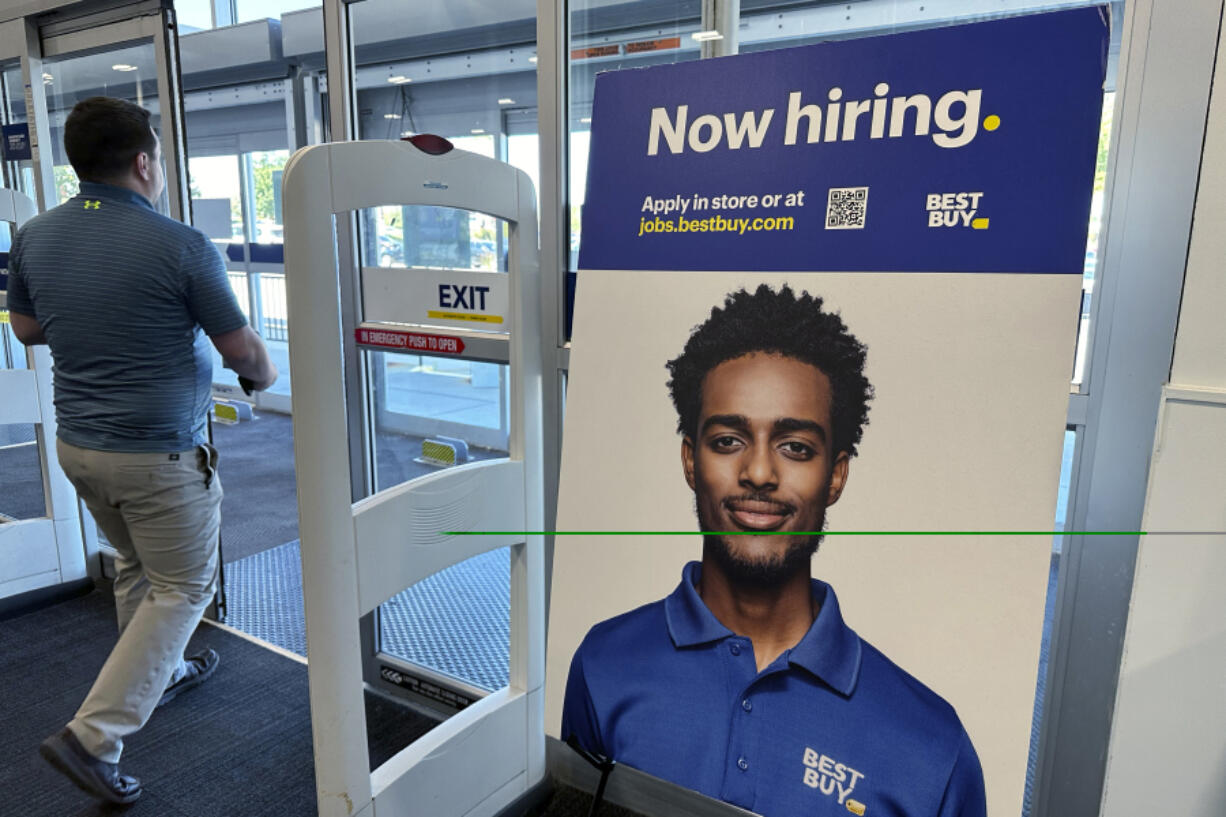 A hiring sign is displayed at a retail store in Vernon Hills, Ill., Saturday, Sept. 7, 2024. (AP Photo/Nam Y.