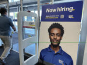 A hiring sign is displayed at a retail store in Vernon Hills, Ill., Saturday, Sept. 7, 2024. (AP Photo/Nam Y.