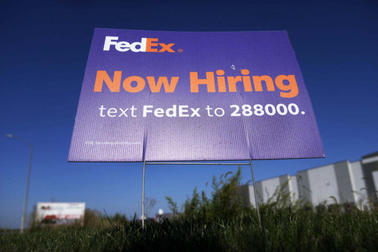 A hiring sign for employment at FedEx is seen, Wednesday, Sept. 4, 2024, in Grimes, Iowa.