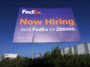 A hiring sign for employment at FedEx is seen, Wednesday, Sept. 4, 2024, in Grimes, Iowa.